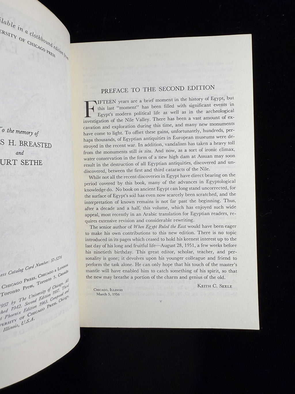 Open book with a preface on a black background