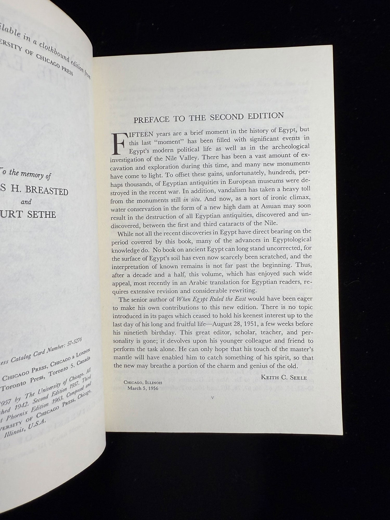 Open book with a preface on a black background